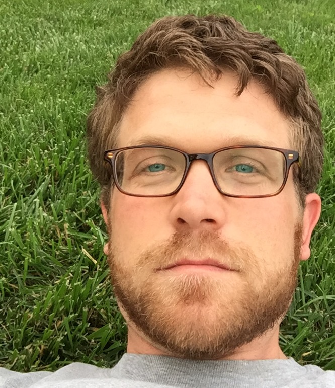 Mark Goodson laying in grass