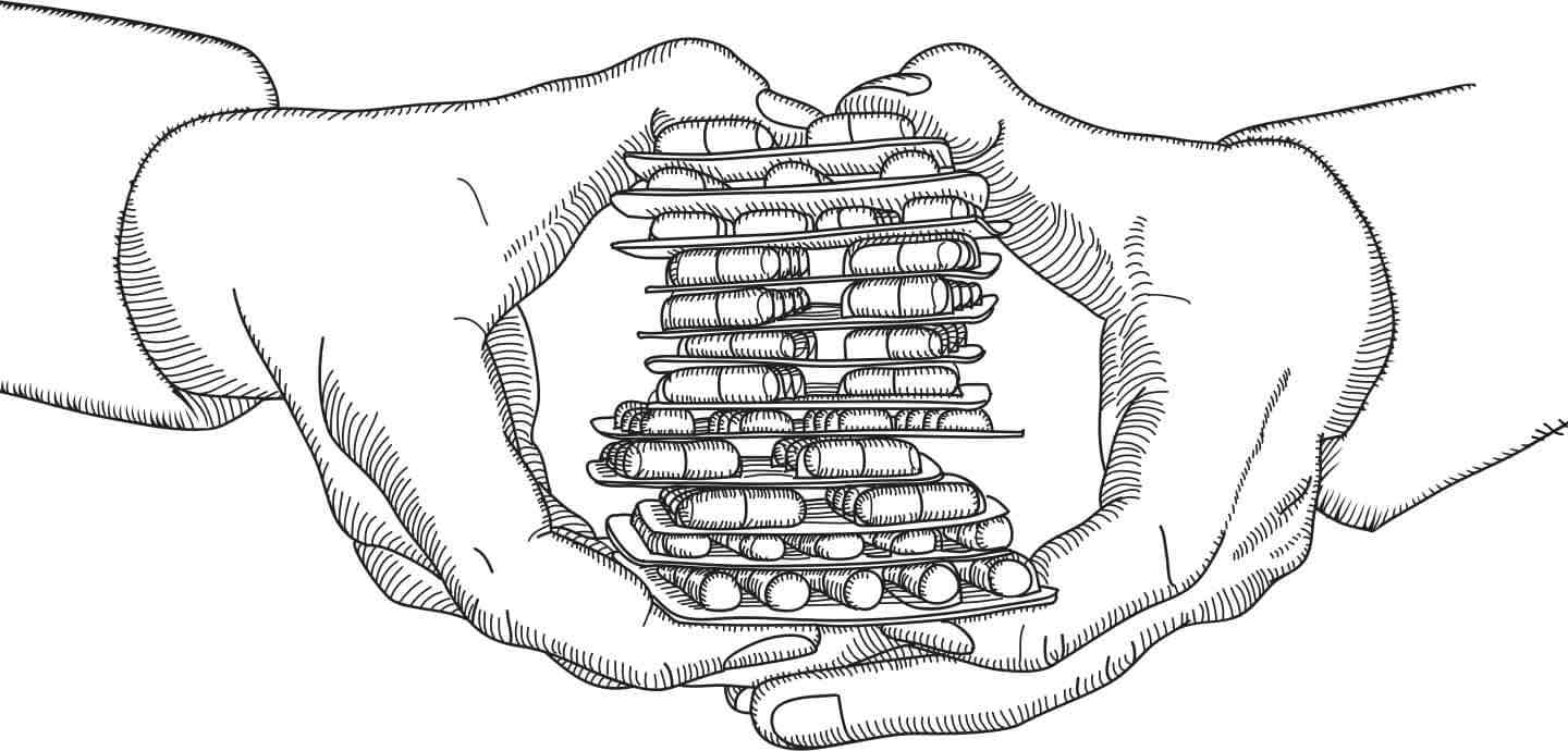 Hands Holding Stacks of Pills